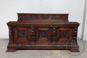 картинка Антикварный комод из дуба в стиле Брейгель с сюжетной резьбой и мифологическими фигурами салоне старинных вещей "Шебби" являющийся официальным дистрибьютором в России и Беларуси