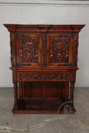 Антикварный поставец с фасадом в виде сложного растительного орнамента и мифологических фигур код. BE107268