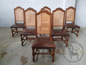 картинка Набор антикварных резных стульев с кожаной обивкой и спинкой из ротанга салоне старинных вещей "Шебби" являющийся официальным дистрибьютором в России и Беларуси